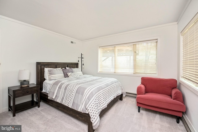 bedroom with a baseboard radiator, light colored carpet, and ornamental molding