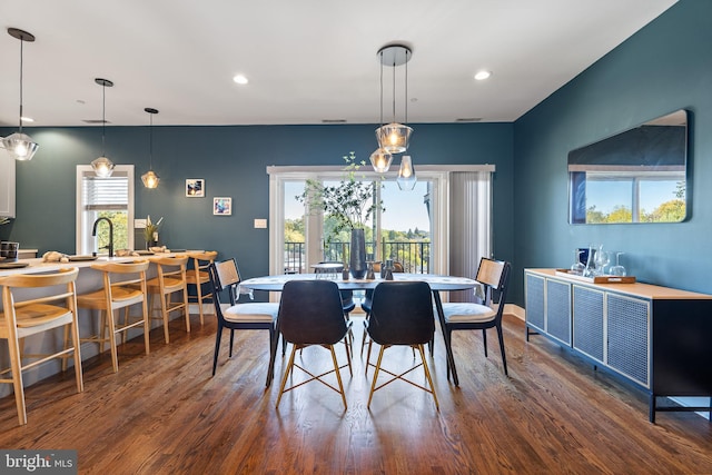 dining room with dark hardwood / wood-style floors