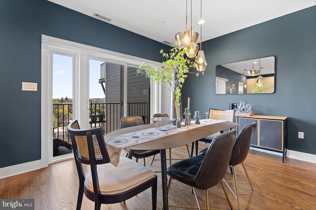 dining room with hardwood / wood-style floors