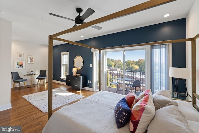 bedroom with wood-type flooring, access to outside, and ceiling fan