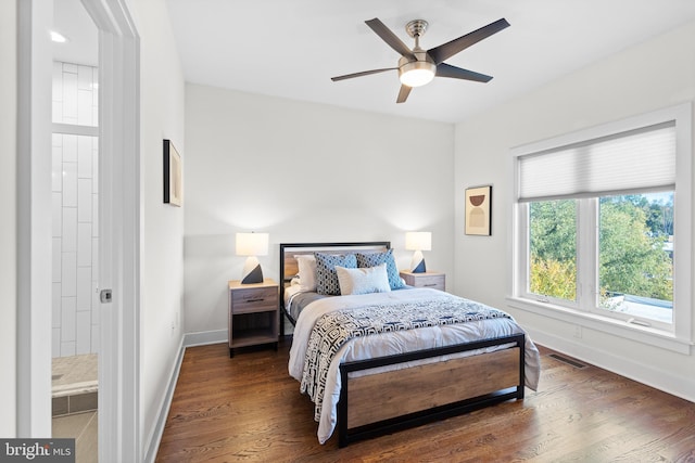 bedroom with ceiling fan and dark hardwood / wood-style floors