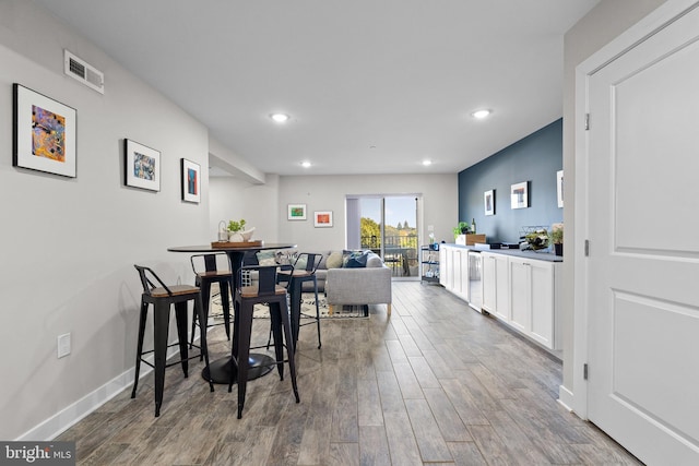 dining space featuring hardwood / wood-style floors