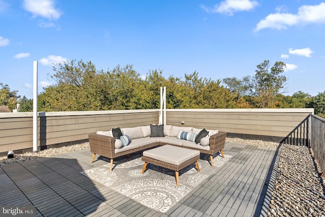 wooden terrace with an outdoor hangout area