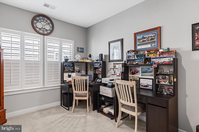 office area featuring light colored carpet