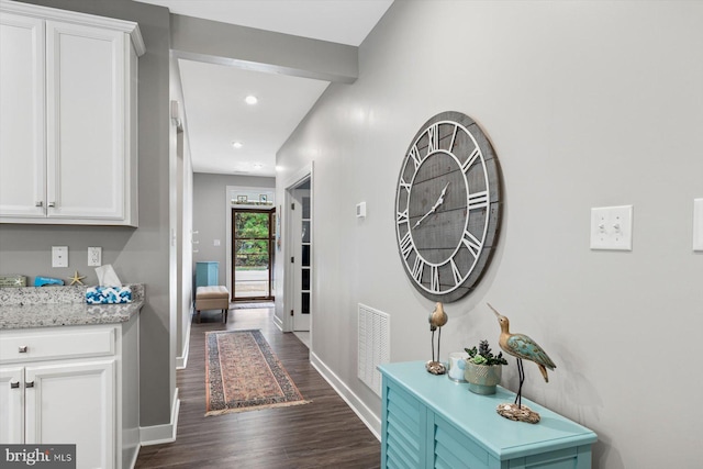 hall with dark hardwood / wood-style floors