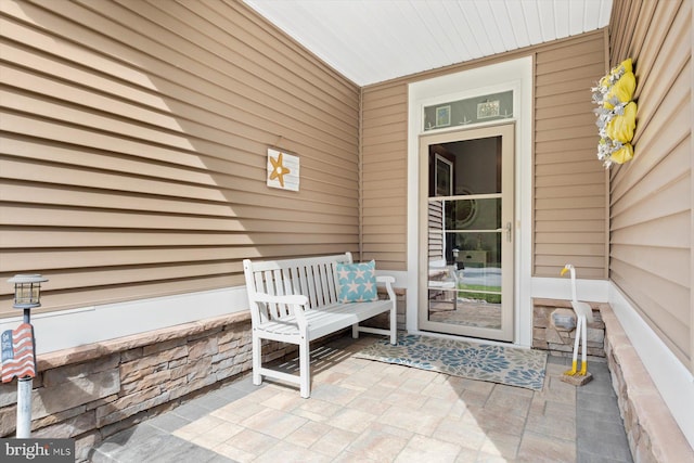 doorway to property with a patio