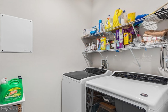 clothes washing area featuring washing machine and dryer