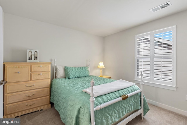 bedroom featuring light carpet