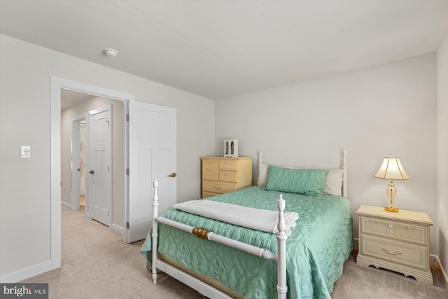 bedroom featuring light colored carpet