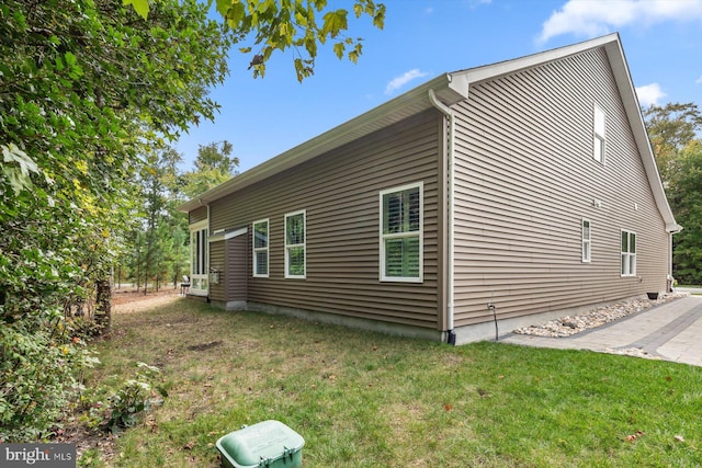 view of property exterior featuring a yard