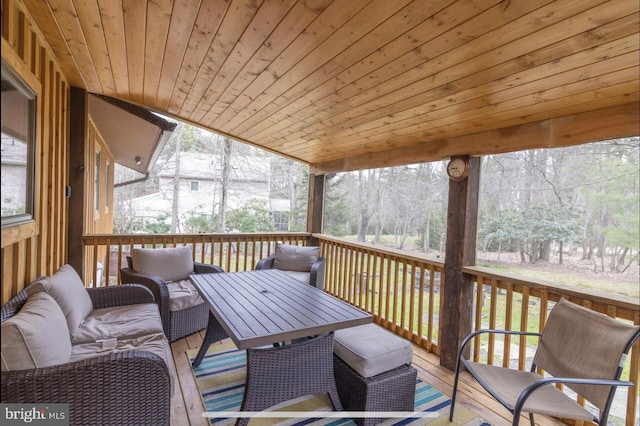 sunroom featuring wood ceiling