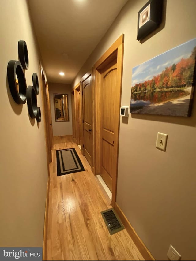 hallway featuring light wood-type flooring