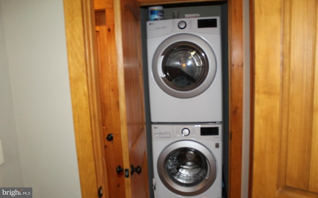 laundry area featuring stacked washer and dryer