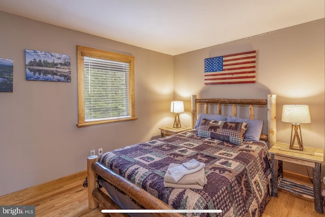 bedroom with light hardwood / wood-style flooring