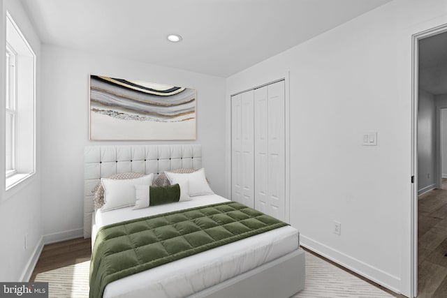 bedroom featuring a closet and hardwood / wood-style flooring