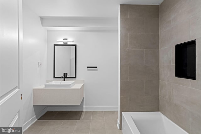 bathroom with vanity, tile patterned flooring, and a washtub