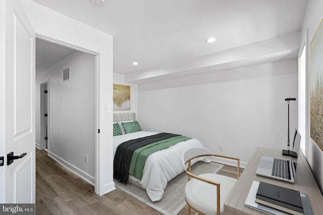 bedroom with hardwood / wood-style flooring