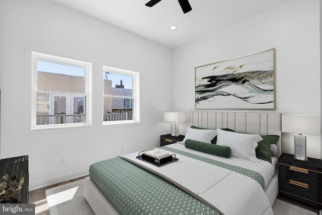 bedroom featuring wood-type flooring and ceiling fan