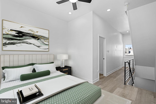 bedroom featuring light wood-type flooring and ceiling fan