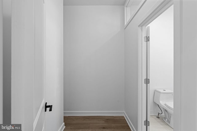 corridor featuring hardwood / wood-style floors