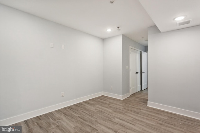 unfurnished room featuring light hardwood / wood-style floors