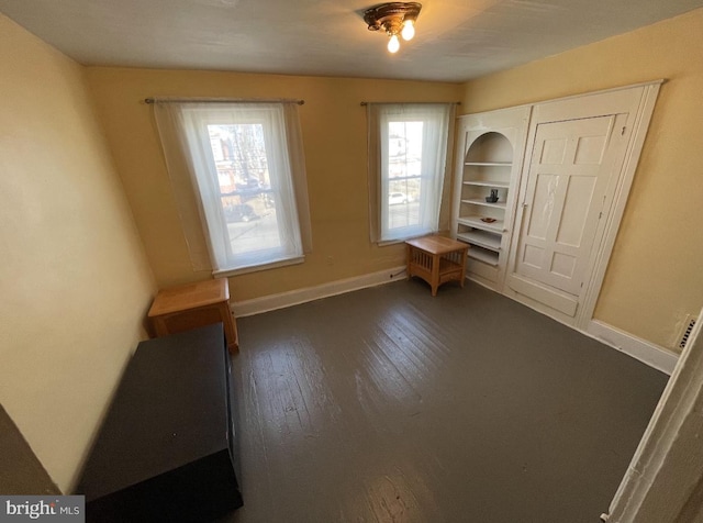 unfurnished bedroom with dark hardwood / wood-style floors