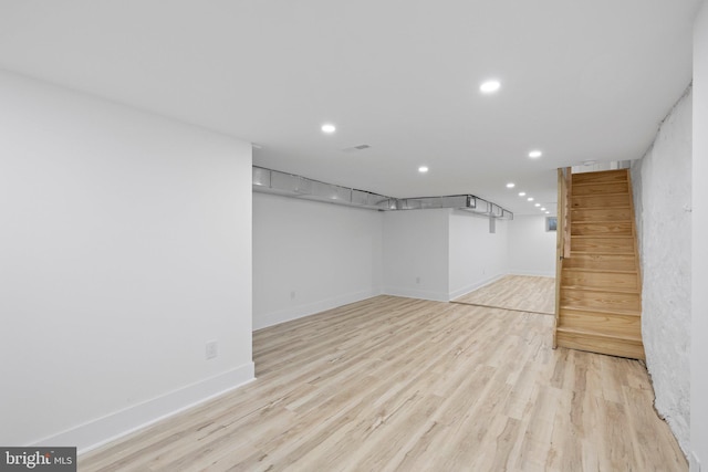 basement featuring light hardwood / wood-style floors