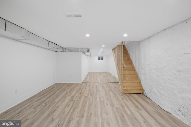 basement featuring light wood-type flooring