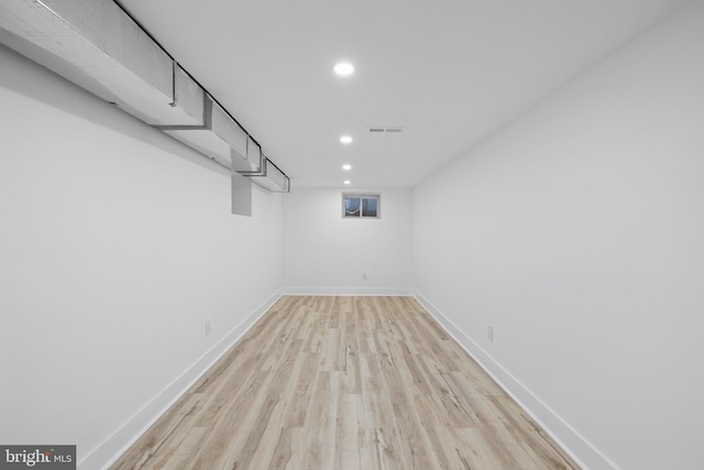 basement featuring light wood-type flooring