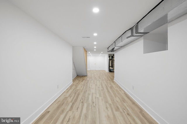 basement featuring light wood-type flooring