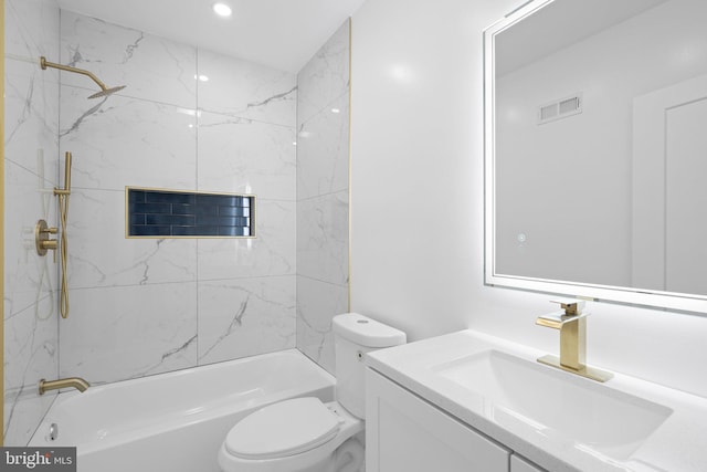 full bathroom featuring tiled shower / bath combo, vanity, and toilet