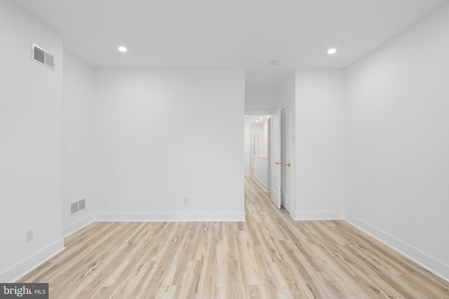 unfurnished room featuring light hardwood / wood-style floors