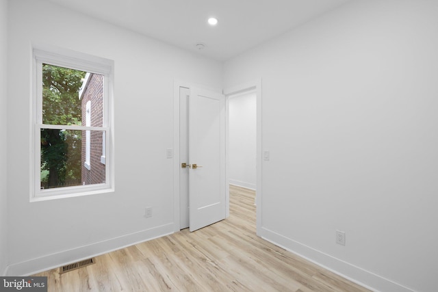 unfurnished room featuring light hardwood / wood-style flooring