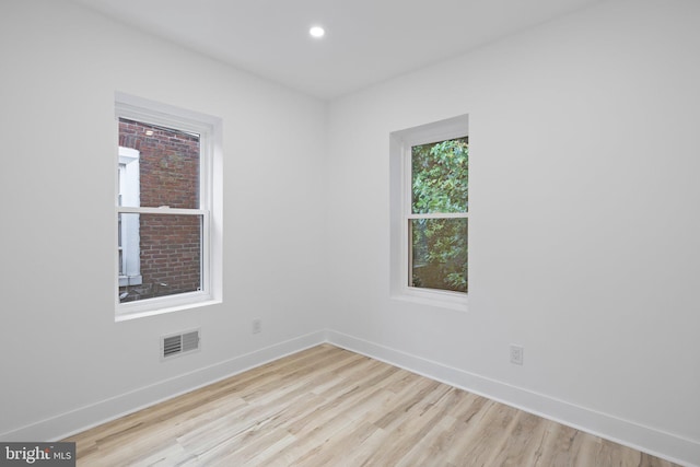 spare room with light wood-type flooring