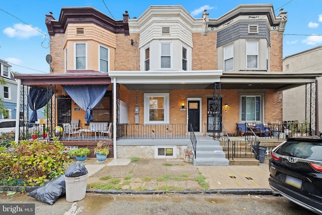 view of property with covered porch