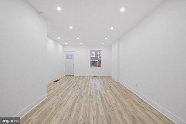 empty room with light hardwood / wood-style floors