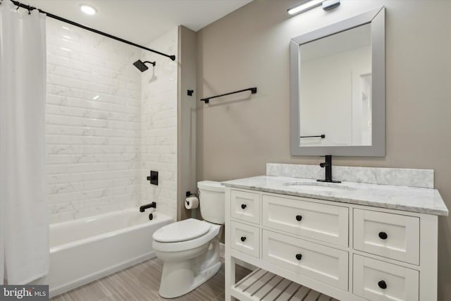 full bathroom featuring vanity, toilet, and shower / bath combination with curtain