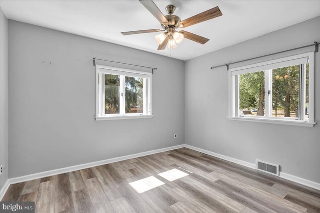 unfurnished room featuring ceiling fan and light wood-type flooring