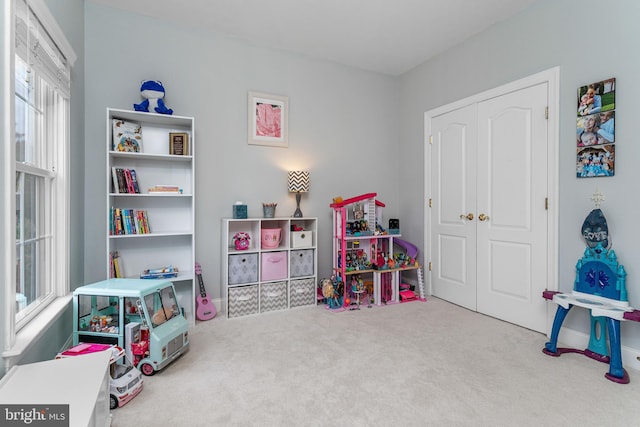 game room with carpet flooring and a wealth of natural light