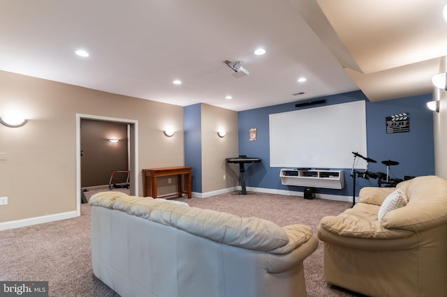 home theater room featuring light colored carpet