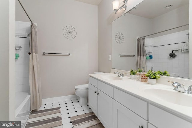 full bathroom with shower / tub combo with curtain, vanity, toilet, and tile patterned floors