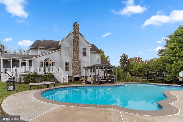 view of pool with a pergola, a patio area, and a deck