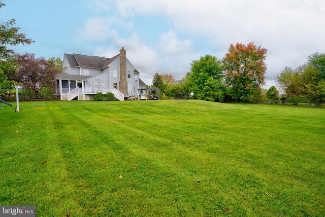 view of yard featuring a wooden deck