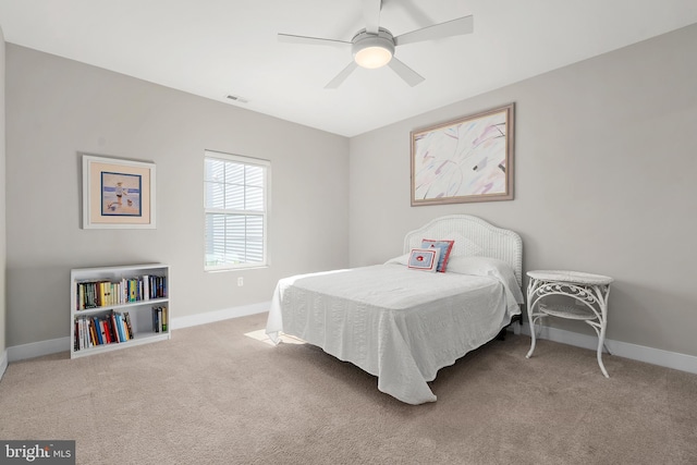 bedroom with light colored carpet and ceiling fan