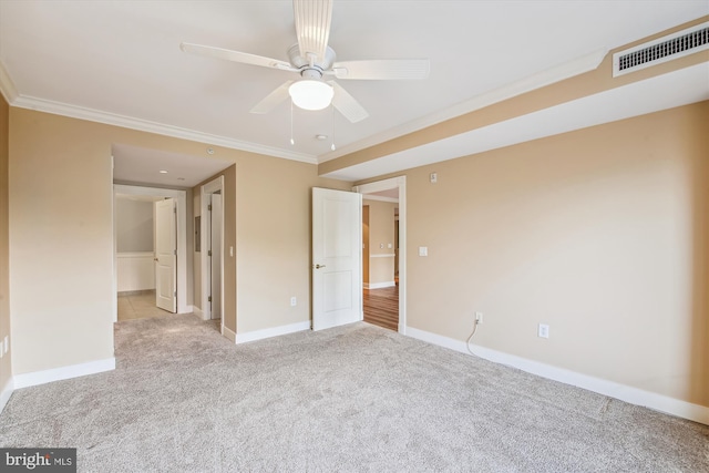 interior space featuring crown molding, ceiling fan, light carpet, and a closet