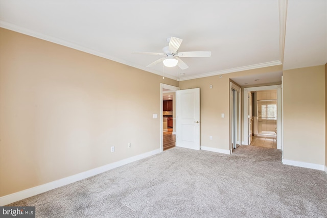 unfurnished bedroom featuring ornamental molding, ceiling fan, and carpet flooring