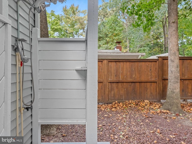 exterior space featuring decorative backsplash