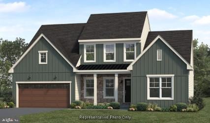 view of front facade with a garage and a front yard