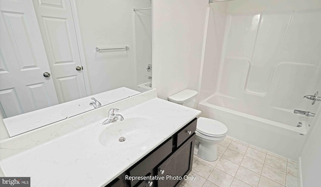 full bathroom with tile patterned floors, shower / bath combination, vanity, and toilet