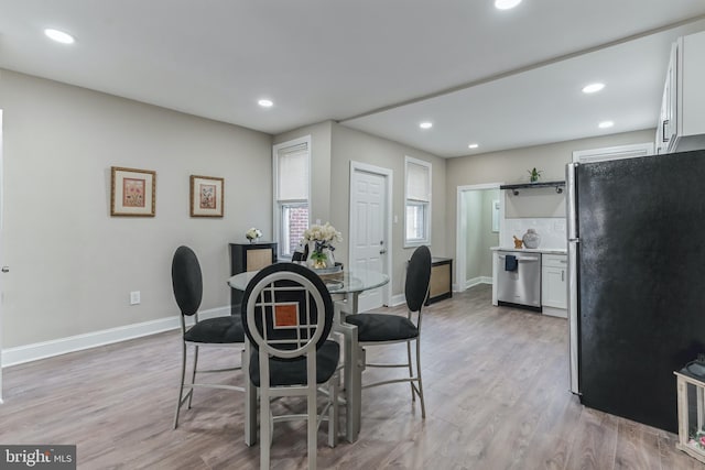 dining space featuring light hardwood / wood-style floors